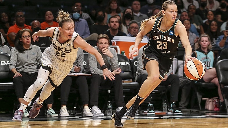 Aug 23, 2022; Brooklyn, New York, USA; New York Liberty guard Marine Johannes (23) steals the ball from Chicago Sky guard Courtney Vandersloot (22) in the third quarter at Barclays Center. Mandatory Credit: Wendell Cruz-USA TODAY Sports