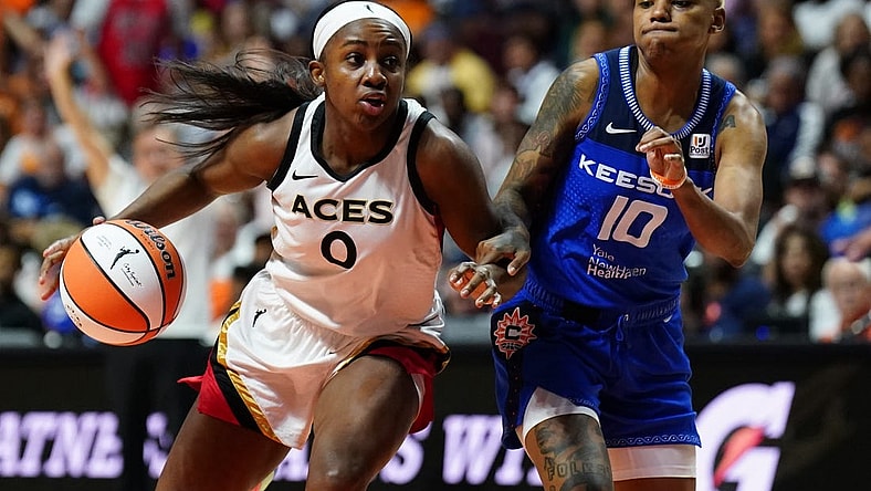 Sep 15, 2022; Uncasville, Connecticut, USA; Las Vegas Aces guard Jackie Young (0) drives the ball against Connecticut Sun guard Courtney Williams (10) in the second half during game three of the 2022 WNBA Finals at Mohegan Sun Arena. Mandatory Credit: David Butler II-USA TODAY Sports