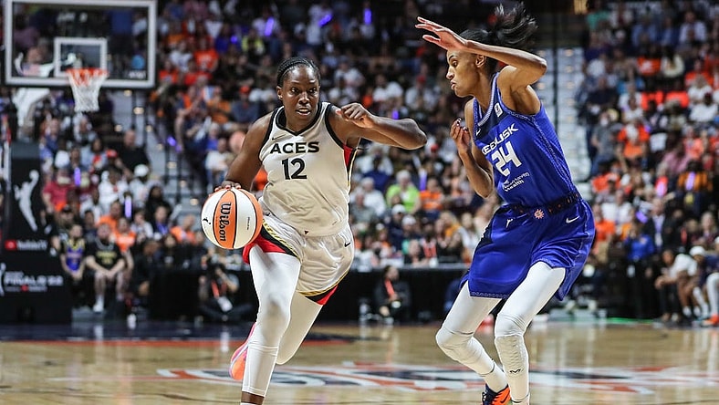 Sep 18, 2022; Uncasville, Connecticut, USA; Las Vegas Aces guard Chelsea Gray (12) and Connecticut Sun forward DeWanna Bonner (24) during game four of the 2022 WNBA Finals at Mohegan Sun Arena. Mandatory Credit: Wendell Cruz-USA TODAY Sports