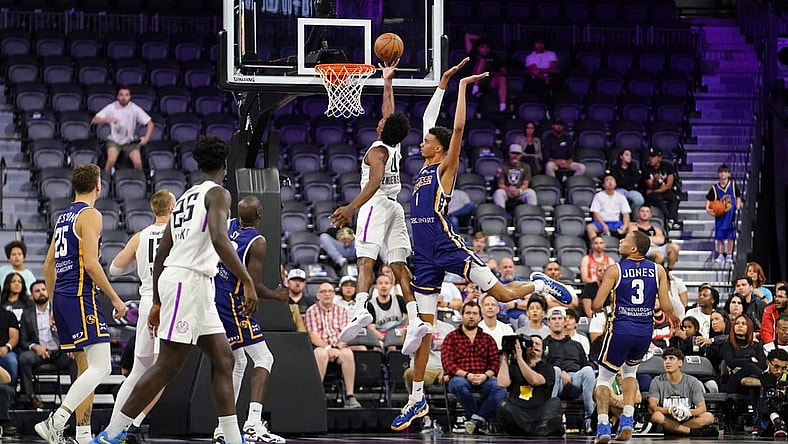 Oct 4, 2022; Henderson, NV, USA; NBA G League Ignite guard Scoot Henderson (0) scores a layup against Boulogne-Levallois Metropolitans 92 forward Victor Wembanyama (1) during the fourth quarter at The Dollar Loan Center. Mandatory Credit: Lucas Peltier-USA TODAY Sports