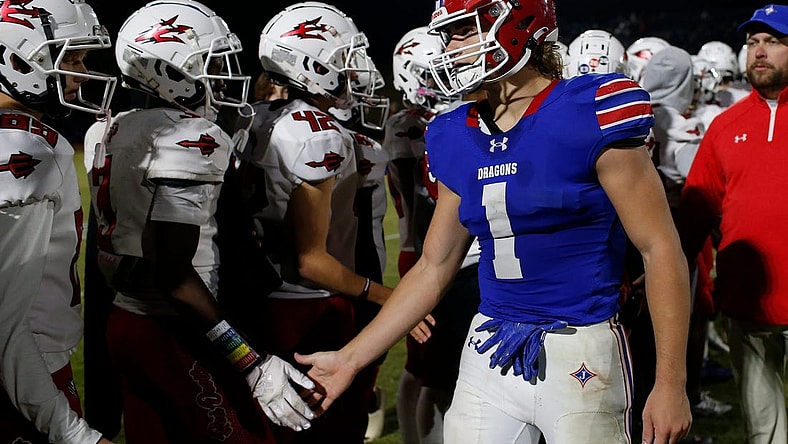 Jefferson's Sammy Brown (1) shakes hands with Loganville players after a GHSA high school football game between Jefferson and Loganville in Jefferson, Ga., on Friday, Oct. 21, 2022. Jefferson won 42-6.

News Joshua L Jones