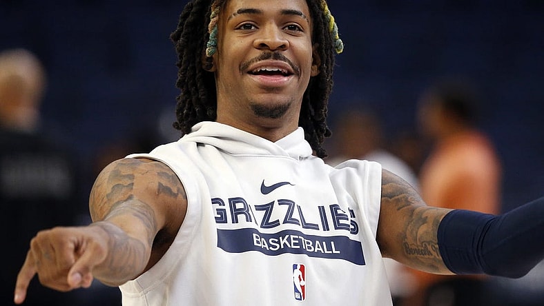 Nov 22, 2022; Memphis, Tennessee, USA; Memphis Grizzlies guard Ja Morant (12) smiles after a shot during warm ups prior to the game against the Sacramento Kings at FedExForum. Mandatory Credit: Petre Thomas-USA TODAY Sports