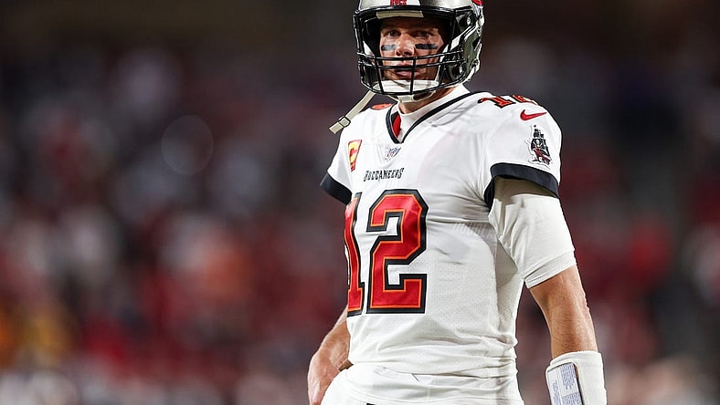 Jan 16, 2023; Tampa, Florida, USA; Tampa Bay Buccaneers quarterback Tom Brady (12) looks on before a  wild card game against the Dallas Cowboys at Raymond James Stadium. Mandatory Credit: Nathan Ray Seebeck-USA TODAY Sports
