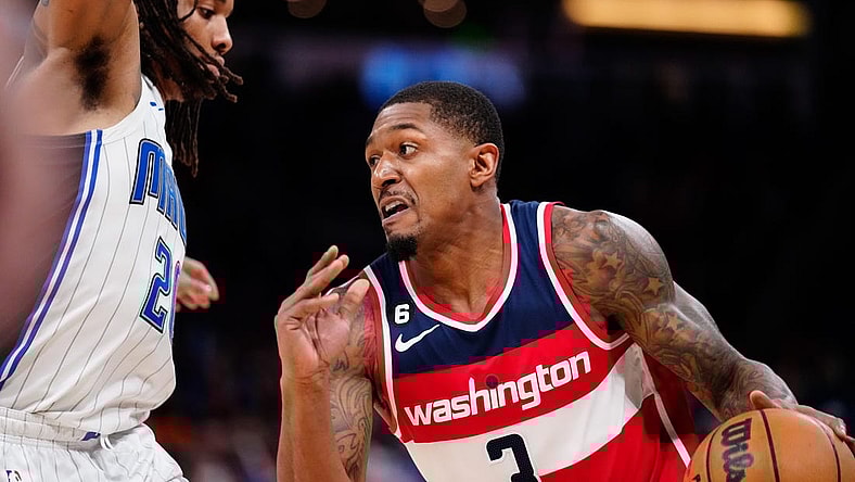 Mar 21, 2023; Orlando, Florida, USA; Washington Wizards guard Bradley Beal (3) dribbles the ball past Orlando Magic guard Markelle Fultz (20) during the second half at Amway Center. Mandatory Credit: Rich Storry-USA TODAY Sports