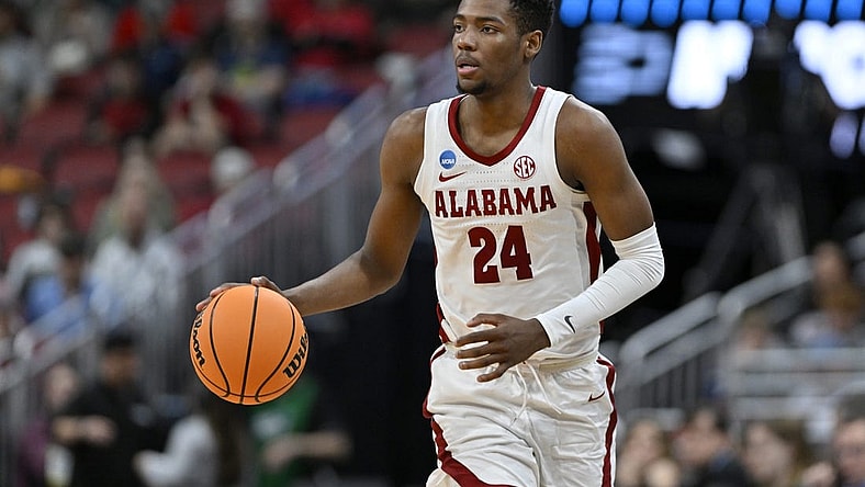 Mar 24, 2023; Louisville, KY, USA; Alabama Crimson Tide forward Brandon Miller (24) dribbles during the second half of the NCAA tournament round of sixteen against the San Diego State Aztecs at KFC YUM! Center. Mandatory Credit: Jamie Rhodes-USA TODAY Sports