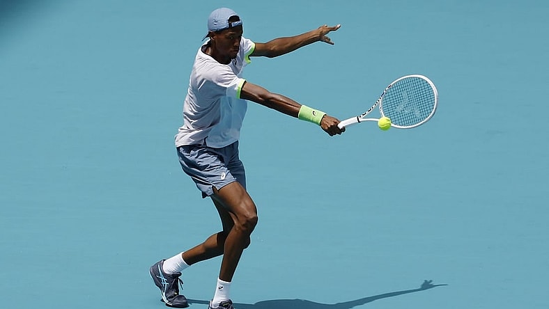 Mar 30, 2023; Miami, Florida, US; Christopher Eubanks (USA) hits a backhand against Daniil Medvedev (not pictured) in a men's singles quarterfinal in the Miami Open at Hard Rock Stadium. Mandatory Credit: Geoff Burke-USA TODAY Sports