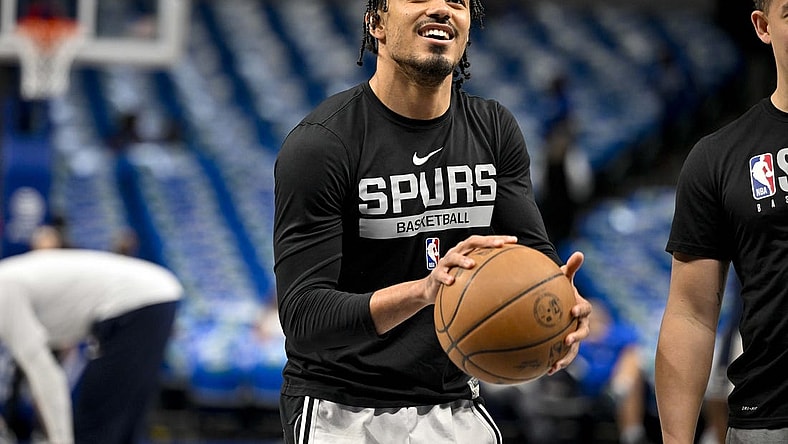 Apr 9, 2023; Dallas, Texas, USA; San Antonio Spurs guard Tre Jones (33) warms up before the game between the Dallas Mavericks and the San Antonio Spurs at the American Airlines Center. Mandatory Credit: Jerome Miron-USA TODAY Sports