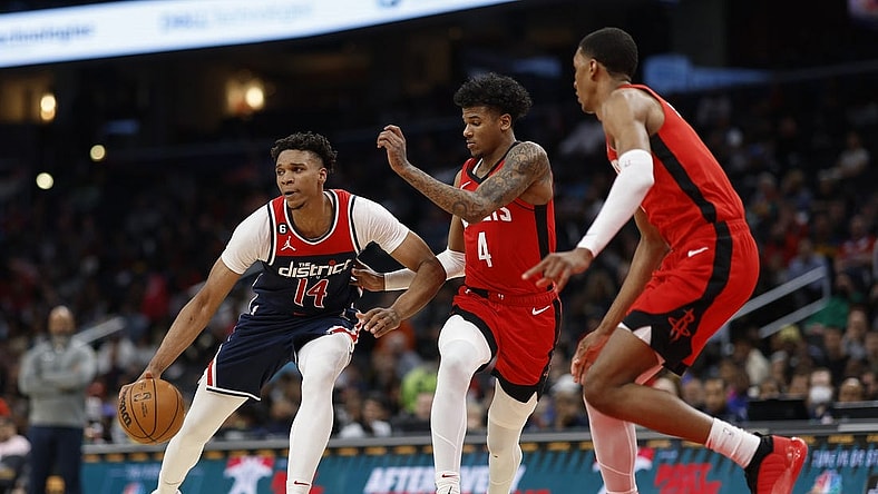 Apr 9, 2023; Washington, District of Columbia, USA;Washington Wizards forward Isaiah Todd (14) dribbles the ball as Houston Rockets guard Jalen Green (4) defends in the third quarter at Capital One Arena. Mandatory Credit: Geoff Burke-USA TODAY Sports