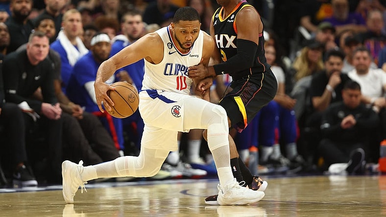 Apr 18, 2023; Phoenix, Arizona, USA; Los Angeles Clippers guard Eric Gordon (10) moves the ball against Phoenix Suns guard Chris Paul (3) in the second half during game two of the 2023 NBA playoffs at Footprint Center. Mandatory Credit: Mark J. Rebilas-USA TODAY Sports