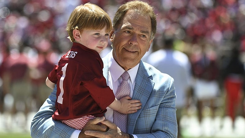 Apr 22, 2023; Tuscaloosa, AL, USA; Alabama head coach Nick Saban holds his grandson before the A-Day game at Bryant-Denny Stadium. Mandatory Credit: Gary Cosby-USA TODAY Sports