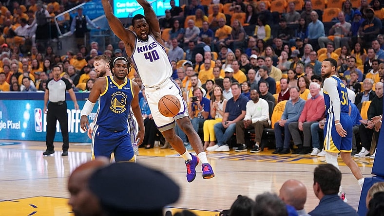 Apr 28, 2023; San Francisco, California, USA; Sacramento Kings forward Harrison Barnes (40) dunks the ball in front of Golden State Warriors forward Kevon Looney (5) in the first quarter during game six of the 2023 NBA playoffs at the Chase Center. Mandatory Credit: Cary Edmondson-USA TODAY Sports