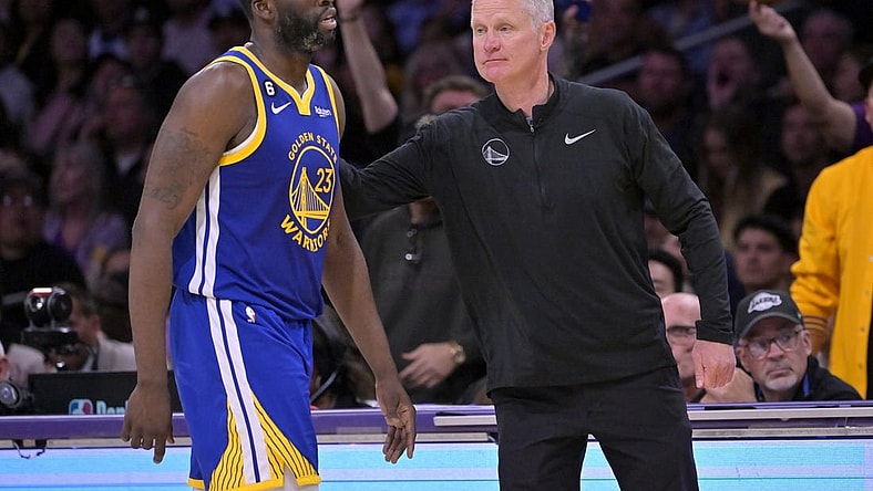 May 12, 2023; Los Angeles, California, USA; Golden State Warriors forward Draymond Green (23) walks past head coach Steve Kerr after fouling out in the second half of game six of the 2023 NBA playoffs at Crypto.com Arena. Mandatory Credit: Jayne Kamin-Oncea-USA TODAY Sports