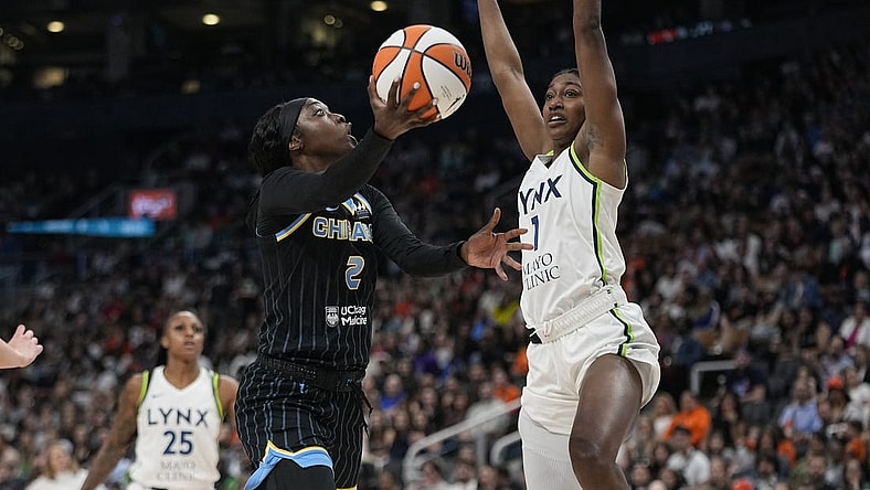 May 13, 2023; Toronto, Ontario, Canada; Chicago Sky guard Kahleah Copper (2) goes up to make a basket as Minnesota Lynx forward Diamond Miller (1) defends during the first half at Scotiabank Arena. Mandatory Credit: John E. Sokolowski-USA TODAY Sports