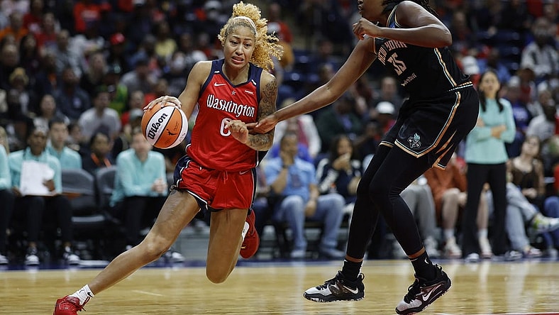 May 19, 2023; Washington, District of Columbia, USA; Washington Mystics center Shakira Austin (0) drives to the basket as New York Liberty forward Jonquel Jones (35) defends in the third quarter at Entertainment & Sports Arena. Mandatory Credit: Geoff Burke-USA TODAY Sports