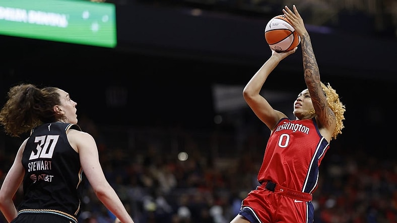 May 19, 2023; Washington, District of Columbia, USA; Washington Mystics center Shakira Austin (0) shoots the ball over New York Liberty forward Breanna Stewart (30) in the third quarter at Entertainment & Sports Arena. Mandatory Credit: Geoff Burke-USA TODAY Sports