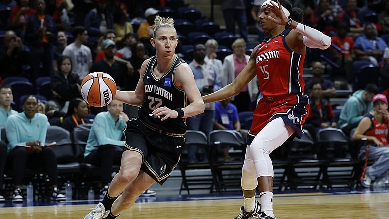 May 19, 2023; Washington, District of Columbia, USA; New York Liberty guard Courtney Vandersloot (22) drives to the basket as Washington Mystics guard Brittney Sykes (15) defends at Entertainment & Sports Arena. Mandatory Credit: Geoff Burke-USA TODAY Sports