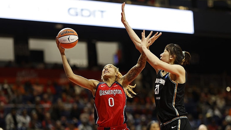 May 19, 2023; Washington, District of Columbia, USA; Washington Mystics center Shakira Austin (0) shoots the ball as New York Liberty center Han Xu (21) defends at Entertainment & Sports Arena. Mandatory Credit: Geoff Burke-USA TODAY Sports