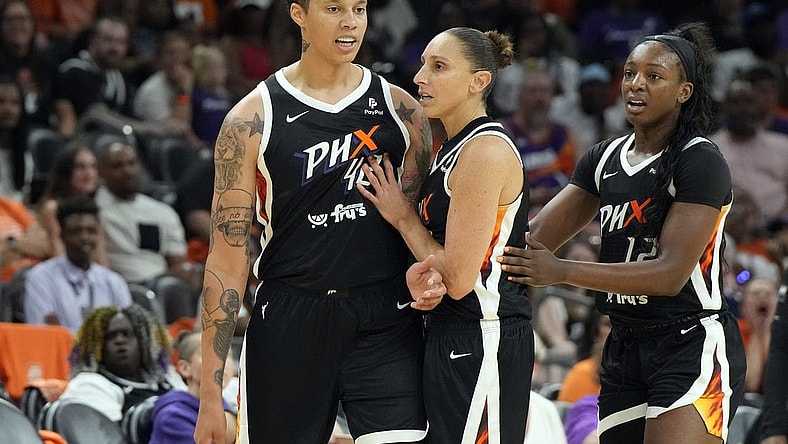 May 21, 2023; Phoenix, Arizona, USA; Phoenix Mercury guard Diana Taurasi (3) holds back Phoenix Mercury center Brittney Griner (42) after a foul call in the second half against the Chicago Sky at Footprint Center. Mandatory Credit: Rick Scuteri-USA TODAY Sports