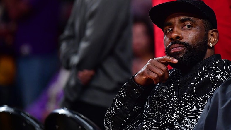 May 22, 2023; Los Angeles, California, USA; American professional basketball player Kyrie Irving watches from the baseline during the second quarter between the Los Angeles Lakers and the Denver Nuggets in game four of the Western Conference Finals for the 2023 NBA playoffs at Crypto.com Arena. Mandatory Credit: Gary A. Vasquez-USA TODAY Sports
