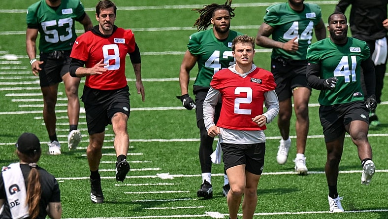 May 23, 2023; Florham Park, NJ, USA; New York Jets quarterback Aaron Rodgers (8) and quarterback Zach Wilson (2) warm up during OTA s at Atlantic Health Jets Training Center. Mandatory Credit: John Jones-USA TODAY Sports