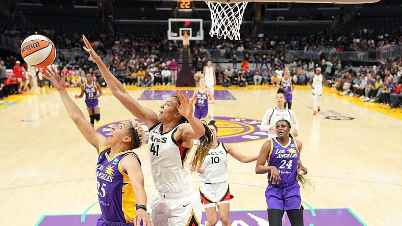 May 25, 2023; Los Angeles, California, USA; LA Sparks guard Layshia Clarendon (25) shoots the ball against Las Vegas Aces center Kiah Stokes (41) during the second half at Crypto.com Arena. Mandatory Credit: Kirby Lee-USA TODAY Sports