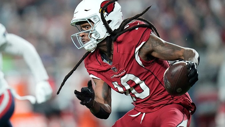 Arizona Cardinals wide receiver DeAndre Hopkins (10) runs with the ball after a catch against the New England Patriots during the third quarter at State Farm Stadium in Glendale on Dec. 12, 2022.