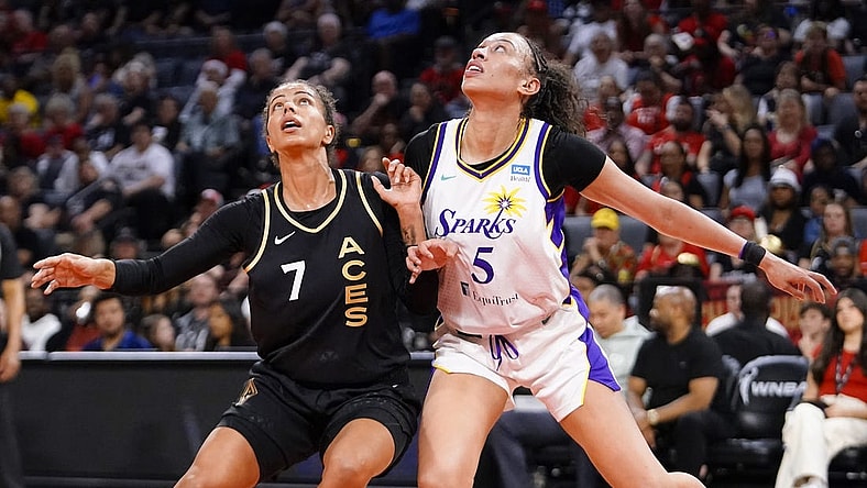 May 27, 2023; Las Vegas, Nevada, USA; Los Angeles Sparks forward Dearica Hamby (5) battles for position against Las Vegas Aces forward Alysha Clark (7) during the first quarter at Michelob Ultra Arena. Mandatory Credit: Lucas Peltier-USA TODAY Sports