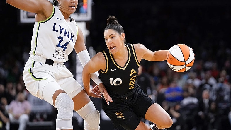 May 28, 2023; Las Vegas, Nevada, USA; Las Vegas Aces guard Kelsey Plum (10) drives the ball against Minnesota Lynx forward Napheesa Collier (24) during the third quarter at Michelob Ultra Arena. Mandatory Credit: Lucas Peltier-USA TODAY Sports
