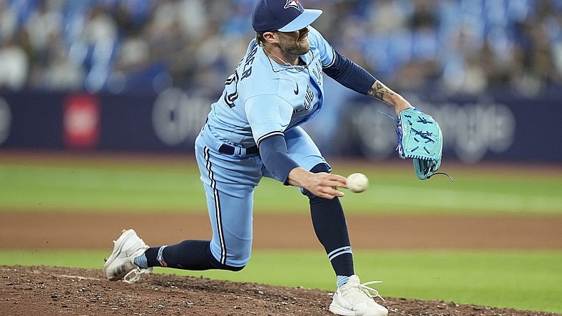 May 30, 2023; Toronto, Ontario, CAN; Toronto Blue Jays pitcher Adam Cimber (90) pitches to the Milwaukee Brewers during the eighth inning at Rogers Centre. Mandatory Credit: John E. Sokolowski-USA TODAY Sports
