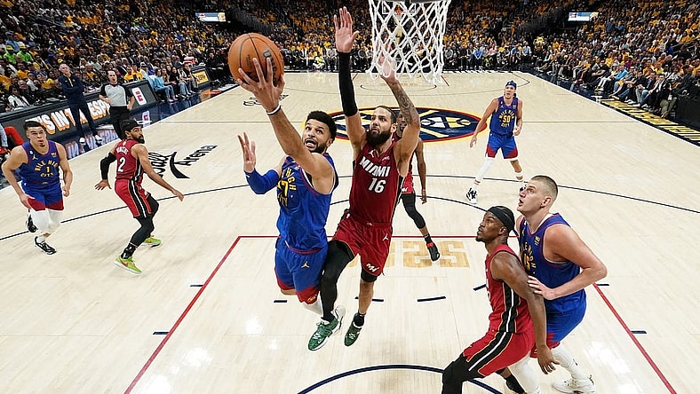 Jun 1, 2023; Denver, CO, USA; Denver Nuggets guard Jamal Murray (27) shoots the ball against Miami Heat forward Caleb Martin (16) during the first half in game one of the 2023 NBA Finals at Ball Arena. Mandatory Credit: Kyle Terada-USA TODAY Sports
