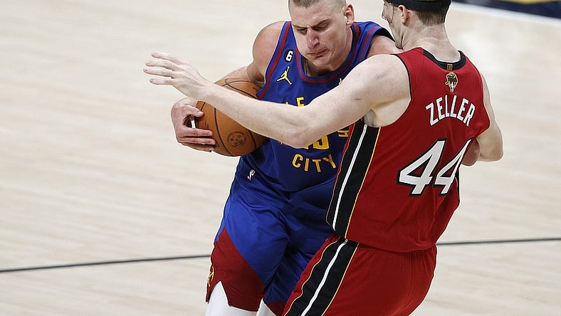 Jun 1, 2023; Denver, CO, USA; Denver Nuggets center Nikola Jokic (15) goes to the basket while defended by Miami Heat center Cody Zeller (44) during the second quarter in game one of the 2023 NBA Finals at Ball Arena. Mandatory Credit: Isaiah J. Downing-USA TODAY Sports