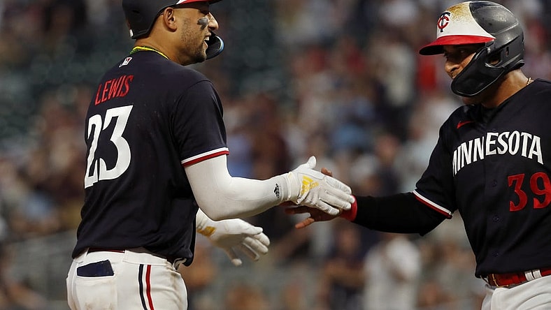 Jun 1, 2023; Minneapolis, Minnesota, USA; Minnesota Twins third baseman Royce Lewis celebrates his two-run home run against the Cleveland Guardians with designated hitter Donovan Solano (39) in the eighth inning at Target Field. Mandatory Credit: Bruce Kluckhohn-USA TODAY Sports