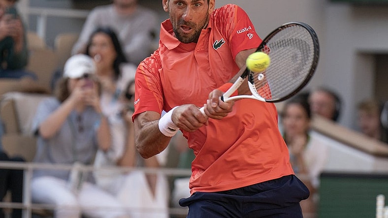 Jun 2, 2023; Paris,France; Novak Djokovic (SRB) returns a shot during his match against Alejandro Davidovich Fokina (ESP) on day six at Stade Roland-Garros. Mandatory Credit: Susan Mullane-USA TODAY Sports