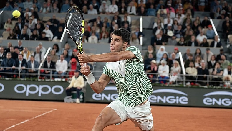 Jun 2, 2023; Paris,France; Carlos Alcaraz (ESP) returns a shot during his match against Denis Shapovalov (CAN) on day six at Stade Roland-Garros. Mandatory Credit: Susan Mullane-USA TODAY Sports
