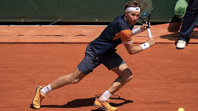 Jun 3, 2023; Paris,France; Casper Ruud (NOR) returns a shot during his match against Zhizhen Zhang (CHN) on day seven at Stade Roland-Garros. Mandatory Credit: Susan Mullane-USA TODAY Sports