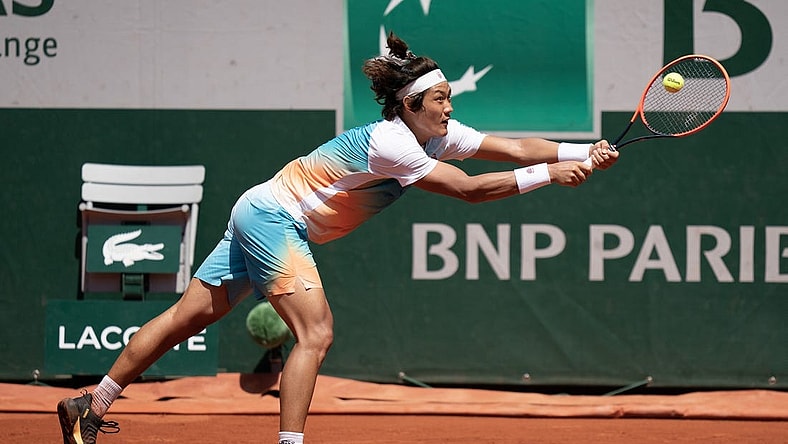 Jun 3, 2023; Paris,France; Zhizhen Zhang (CHN) returns a shot during his match against Casper Ruud (NOR) on day seven at Stade Roland-Garros. Mandatory Credit: Susan Mullane-USA TODAY Sports