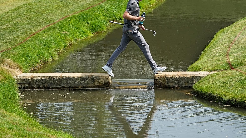 June 3, 2023; Dublin, Ohio, USA;  Keegan Bradley crosses the creek as he walks to the 14th green during the third round of the Memorial Tournament at Muirfield Village Golf Club.