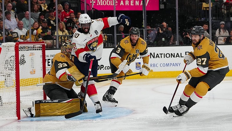 Jun 3, 2023; Las Vegas, Nevada, USA; Florida Panthers left wing Anthony Duclair (10) tries to get a shot off against Vegas Golden Knights goaltender Adin Hill (33) and Vegas Golden Knights defenseman Brayden McNabb (3) during the third period in game one of the 2023 Stanley Cup Final at T-Mobile Arena. Mandatory Credit: Stephen R. Sylvanie-USA TODAY Sports