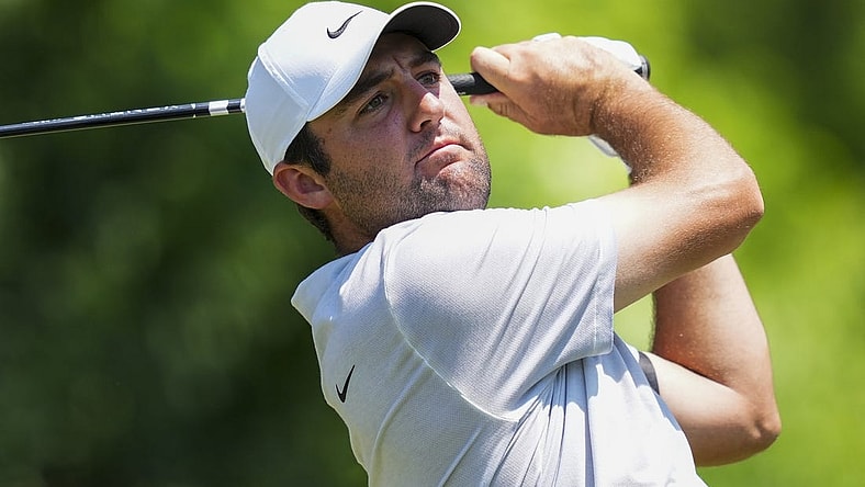 Jun 4, 2023; Dublin, Ohio, USA; Scottie Scheffler plays his shot from the 15th tee during the final round of the Memorial Tournament golf tournament at the Muirfield Village Golf Club. Mandatory Credit: Aaron Doster-USA TODAY Sports