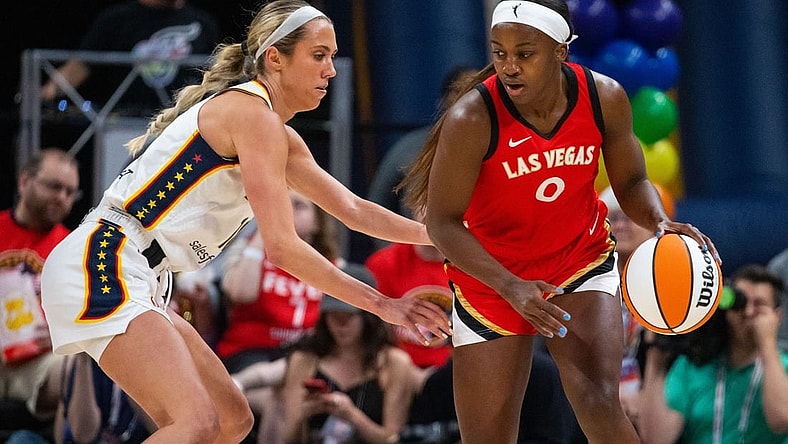 Jun 4, 2023; Indianapolis, Indiana, USA; Las Vegas Aces guard Jackie Young (0) dribbles the ball while Indiana Fever guard Lexie Hull (10) defends in the first half at Gainbridge Fieldhouse. Mandatory Credit: Trevor Ruszkowski-USA TODAY Sports