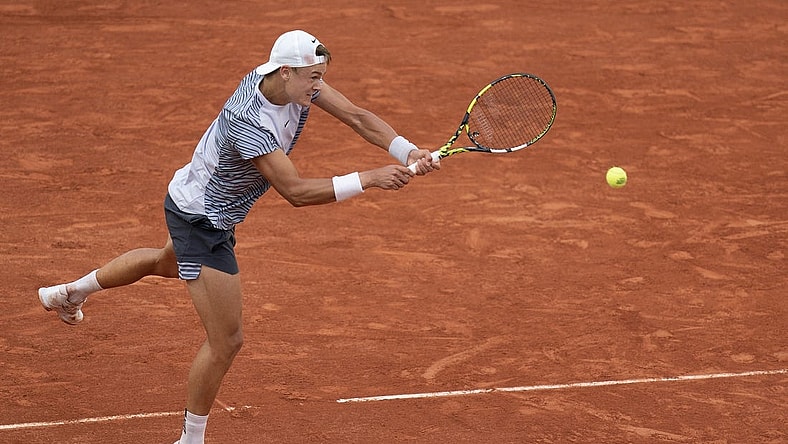 Jun 5 2023; Paris, France; Holger Rune (DEN) returns a shot against Francisco Cerundolo (ARG) on day nine at Stade Roland-Garros. Mandatory Credit: Susan Mullane-USA TODAY Sports