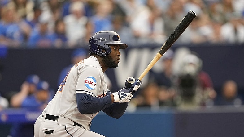 Jun 5, 2023; Toronto, Ontario, CAN; Houston Astros designated hitter Yordan Alvarez (44) hits an RBI single against the Toronto Blue Jays during the first inning at Rogers Centre. Mandatory Credit: John E. Sokolowski-USA TODAY Sports