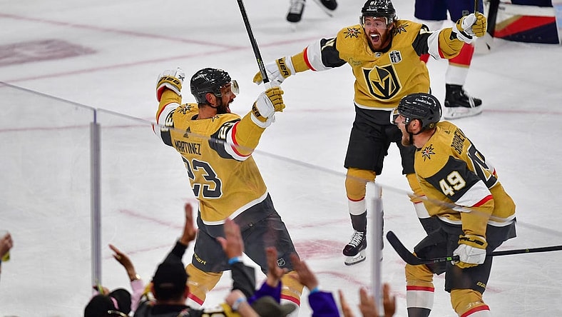 Jun 5, 2023; Las Vegas, Nevada, USA; Vegas Golden Knights defenseman Alec Martinez (23) celebrates a goal with right wing Jonathan Marchessault (81) and center Ivan Barbashev (49) in the first period against the Florida Panthers in game two of the 2023 Stanley Cup Final at T-Mobile Arena. Mandatory Credit: Gary A. Vasquez-USA TODAY Sports