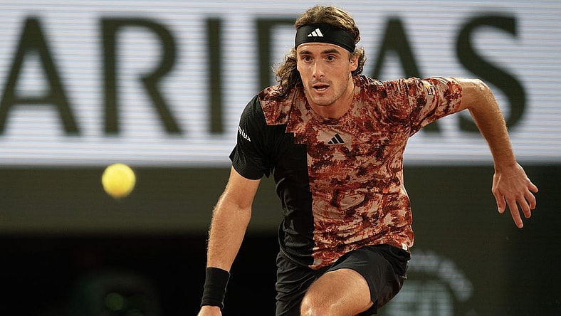 Jun 6 2023; Paris, France; Stefanos Tsitsipas (GRE) runs for the ball during a match against Carlos Alcaraz (ESP) on day 10 at Stade Roland-Garros. Mandatory Credit: Susan Mullane-USA TODAY Sports