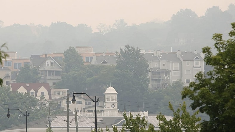A smoky haze surrounds Tarrytown Village Hall and nearby residences June 7, 2023. The state Department of Environmental Conservation issued air quality advisories for most of New York due to smoke from wildfires in Canada.