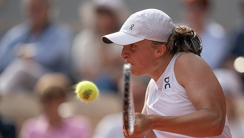 Jun 10, 2023; Paris,France; Iga Swiatek (POL) returns a shot during the French Open final against Karolina Muchova (CZE) on day 14 at Stade Roland-Garros. Mandatory Credit: Susan Mullane-USA TODAY Sports