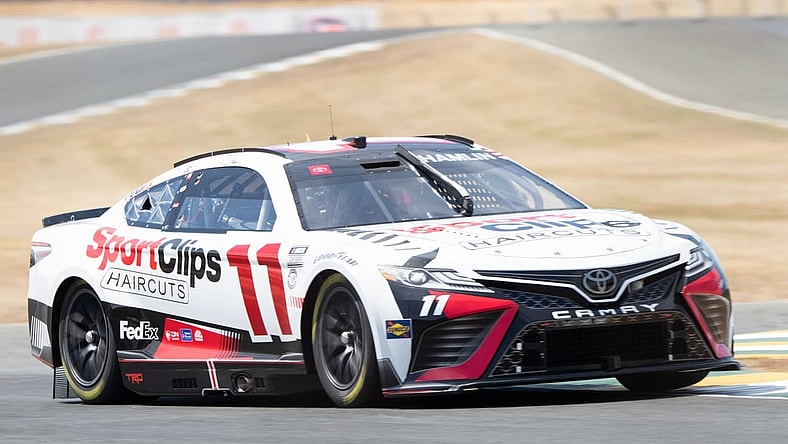 Jun 10, 2023; Sonoma, California, USA; NASCAR Cup Series driver Denny Hamlin (11) performs a practice lap before qualifications at Sonoma Raceway. Mandatory Credit: Stan Szeto-USA TODAY Sports