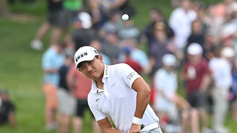 Jun 10, 2023; Toronto, ON, CAN;  C.T. Pan chips onto the green on the 18th hole during the third round of the RBC Canadian Open golf tournament. Mandatory Credit: Dan Hamilton-USA TODAY Sports