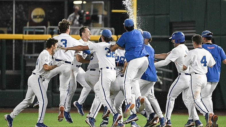 Jun 16, 2023; Omaha, NE, USA; Florida Gators designated hitter Luke Heyman (28) celebrates with teammates after hitting a walk off sacrifice fly against the Virginia Cavaliers in the ninth inning at Charles Schwab Field Omaha. Mandatory Credit: Steven Branscombe-USA TODAY Sports