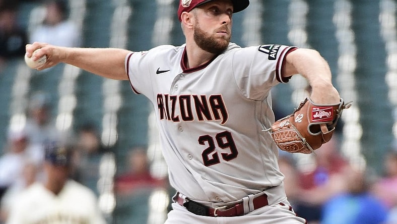Jun 19, 2023; Milwaukee, Wisconsin, USA; Arizona Diamondbacks pitcher Merrill Kelly (29) pitches against the Milwaukee Brewers in the first inning at American Family Field. Mandatory Credit: Benny Sieu-USA TODAY Sports